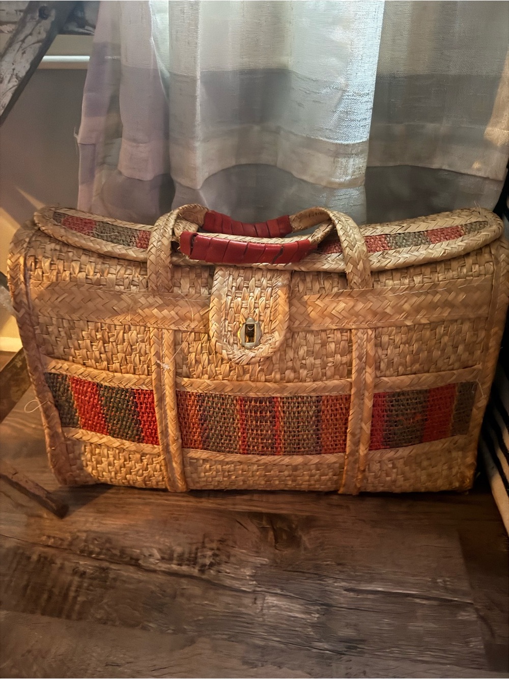 Very good condition. Woven Straw Travel Tote with burnt orange Accent Handles